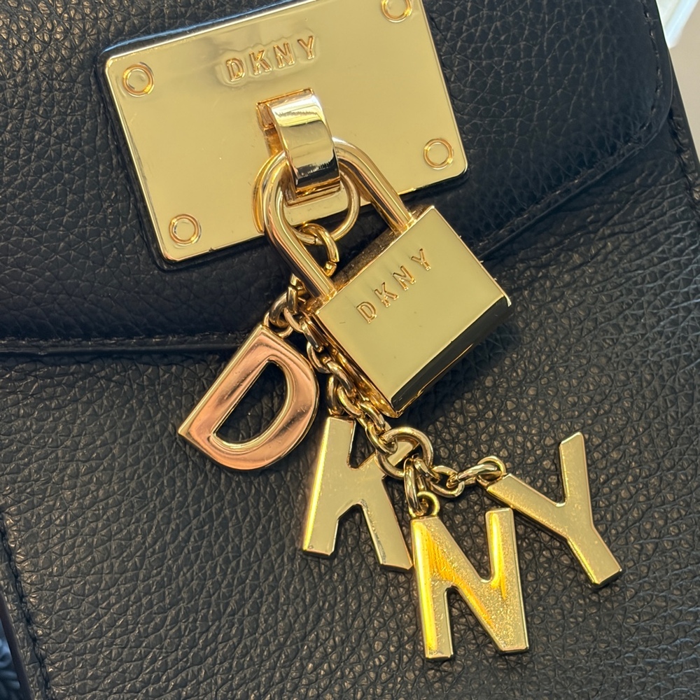 DKNY crossbody with gold logo charms and lock